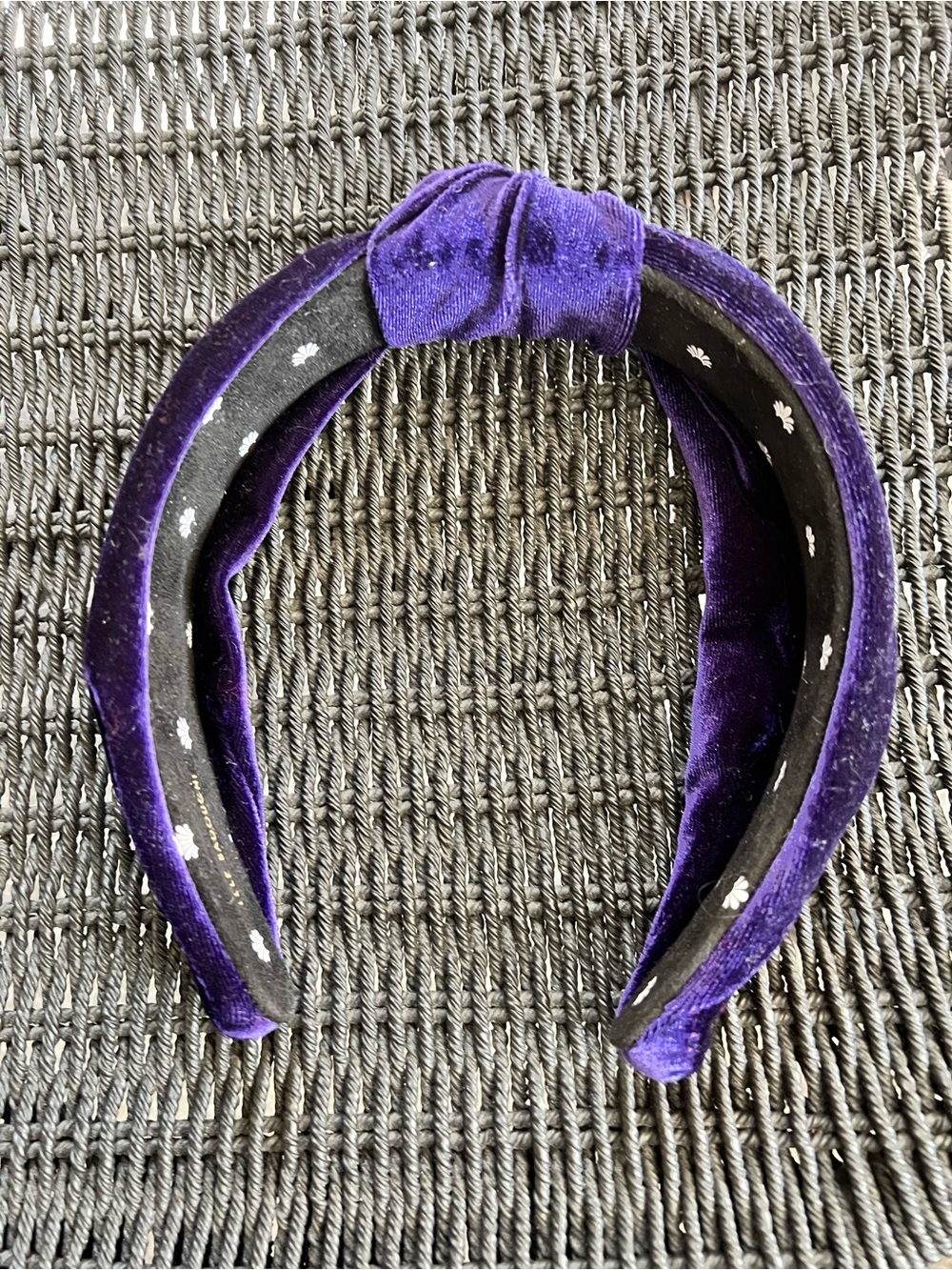 Lele Sadoughi plush deep purple velvet top knot head band, inner brand logo.